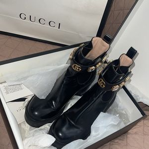 GUCCI Women’s leather ankle boot with belt and snake on sole
